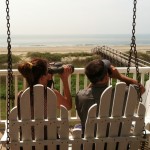 Couple with Binos viewing Kahala Beach in Galveston Texas